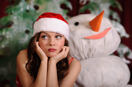 Studio shot of beautiful young woman in snowgirl dressの写真素材