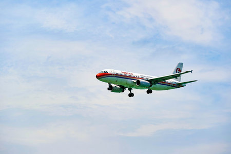 HONG KONG - JUNE 04, 2015: China Eastern Airlines aircraft landing at Hong Kong airport. China...