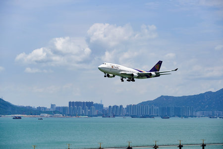 HONG KONG - JUNE 04, 2015: THAI aircraft landing at Hong Kong airport. Thai Airways International Public Company Limited, also trading as THAI is the flag carrier airline of Thailandのeditorial素材