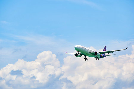 HONG KONG - JUNE 04, 2015: THAI aircraft landing at Hong Kong airport. Thai Airways International Public Company Limited, also trading as THAI is the flag carrier airline of Thailandのeditorial素材