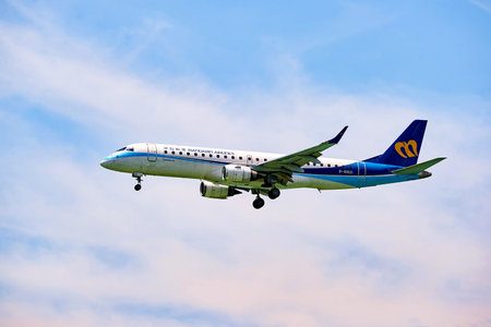 HONG KONG - JUNE 04, 2015: Mandarin Airlines aircraft landing at Hong Kong airport. Mandarin...