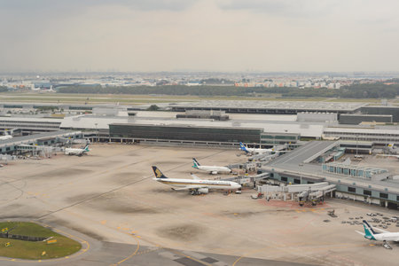 SINGAPORE - NOVEMBER 04, 2015: View of the airport from aircraft. Singapore Changi Airport is the primary civilian airport for Singapore, and one of the largest transportation hubs in Southeast Asia.のeditorial素材