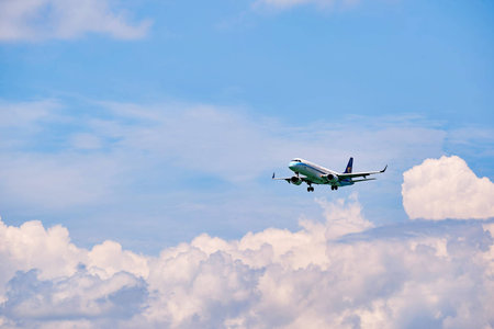 HONG KONG - JUNE 04, 2015: Mandarin Airlines aircraft landing at Hong Kong airport. Mandarin...