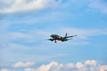 HONG KONG - JUNE 04, 2015: Jetstar aircraft landing at Hong Kong airport. Jetstar Airways Pty Ltd,...
