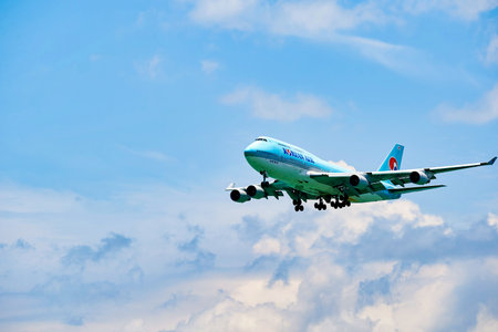 HONG KONG - JUNE 04, 2015: Korean Air Boeing 747  landing at Hong Kong airport. Korean Air Lines Co., Ltd. operating as Korean Air, is the largest airline in South Korea based on fleet size, international destinations and international flights.のeditorial素材