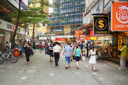 HONG KONG - JUNE 01, 2015: people on streets of Hong Kong. Hong Kong, is an autonomous territory on...