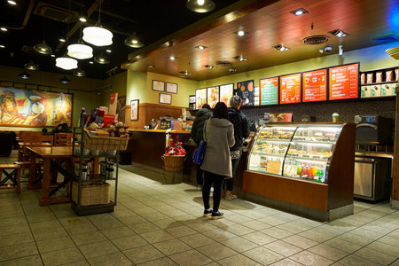 SHENZHEN, CHINA - JANUARY 22, 2016: interior of Starbucks Cafe. Starbucks Corporation is an American global coffee company and coffeehouse chain based in Seattle, Washingtonのeditorial素材