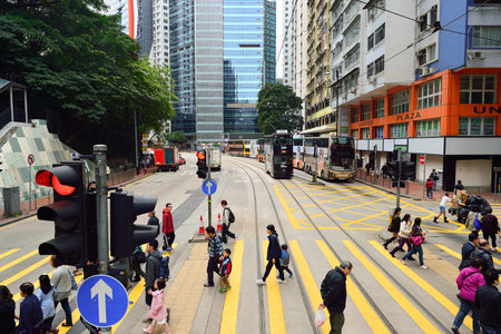 HONG KONG - DECEMBER 25, 2015: view from upper deck of double-decker tramway. The tram is the...