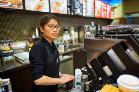 SHENZHEN, CHINA - JANUARY 22, 2016: interior of Starbucks Cafe. Starbucks Corporation is an American...