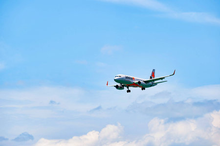 HONG KONG - JUNE 04, 2015: Jetstar aircraft landing at Hong Kong airport. Jetstar Airways Pty Ltd,...