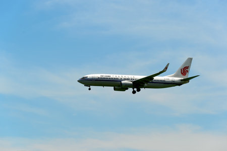 HONG KONG - JUNE 04, 2015: Air China aircraft landing at Hong Kong airport. Air China Limited is the...