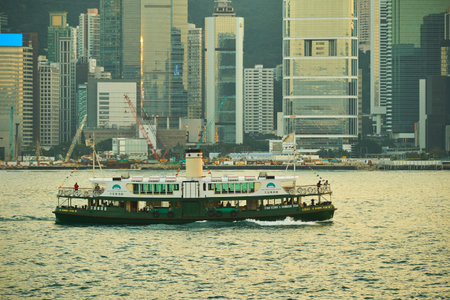 HONG KONG - JANUARY 25, 2016: A Star Ferry carries passengers around Victoria Harbour. The Star Ferry's Harbour Tour runs a circular route of an hour around Victoria Harbourのeditorial素材