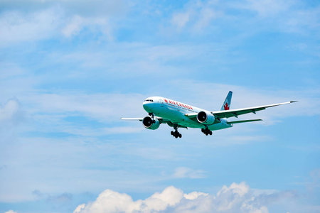 HONG KONG - JUNE 04, 2015: Air Canada Boeing 777 landing at Hong Kong airport. Air Canada is the...