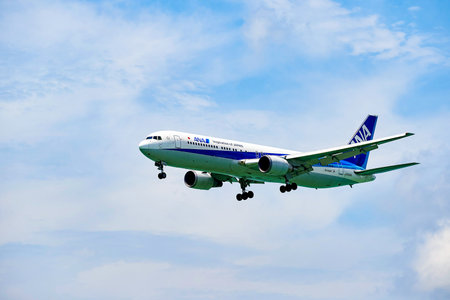 HONG KONG - JUNE 04, 2015: ANA aircraft landing at Hong Kong airport. All Nippon Airways Co., Ltd....
