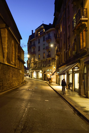 GENEVA, SWITZERLAND - NOVEMBER 18, 2015: streets of Geneva at night. Geneva is a global city, a financial center, and worldwide center for diplomacy due to the presence of numerous international organizations.のeditorial素材