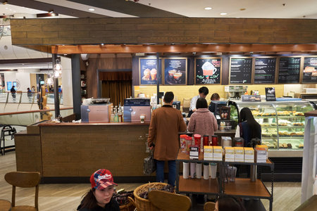 HONG KONG - JANUARY 27, 2016: interior of Starbucks cafe. Starbucks Corporation is an American...