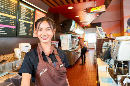 PATTAYA, THAILAND - FEBRUARY 21, 2016: worker at McCafe in Thailand. McCafe is a coffee-house-style food and drink chain, owned by McDonald's.のeditorial素材