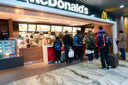 MACAO - FEBRUARY 17, 2016: people in McDonald's restaurant. McDonald's primarily sells hamburgers,...
