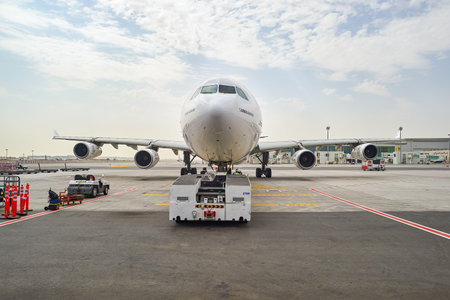 DUBAI, UAE - JUNE 23, 2015: Emirates Airbus A340-300 in Dubai airport. Dubai International Airport...