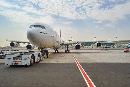 DUBAI, UAE - JUNE 23, 2015: Emirates Airbus A340-300 in Dubai airport. Dubai International Airport...