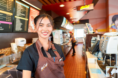 PATTAYA, THAILAND - FEBRUARY 21, 2016: worker at McCafe in Thailand. McCafe is a coffee-house-style food and drink chain, owned by McDonald's.のeditorial素材