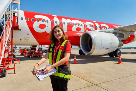 PATTAYA, THAILAND - FEBRUARY 26, 2016: ground crew member at U-Tapao International Airport. U-Tapao Rayong-Pattaya International Airport is a joint civil-military public airport serving Rayong and Pattaya cities in Thailand.のeditorial素材