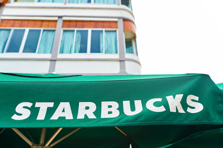 PATTAYA, THAILAND - FEBRUARY 20, 2016: umbrella with Starbucks inscription. Starbucks Corporation is an American global coffee company and coffeehouse chain based in Seattle, Washingtonのeditorial素材
