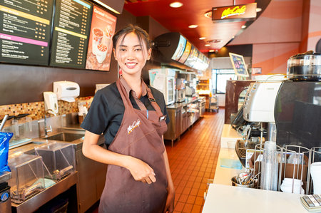 PATTAYA, THAILAND - FEBRUARY 21, 2016: worker at McCafe in Thailand. McCafe is a coffee-house-style food and drink chain, owned by McDonald's.のeditorial素材
