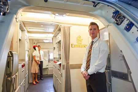 BANGKOK, THAILAND - MARCH 31, 2015: Emirates crew member meet passengers on second floor of A380....