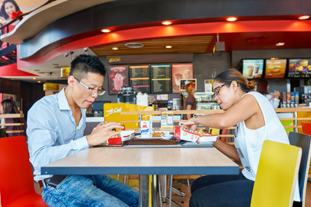PATTAYA, THAILAND - FEBRUARY 25, 2016: people eat at McDonald's restaurant. McDonald's primarily sells hamburgers, cheeseburgers, chicken, french fries, breakfast items, soft drinks, milkshakes, and dessertsのeditorial素材