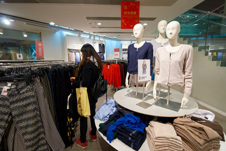 HONG KONG - JANUARY 27, 2016: interior of H&M store. H & M Hennes & Mauritz AB is a Swedish multinational retail-clothing company, known for its fast-fashion clothing for men, women, teenagers and children.のeditorial素材