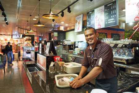 SINGAPORE - NOVEMBER 03, 2015: portrait of Costa Coffee barista. Costa Coffee is the second largest coffeehouse chain in the world behind Starbucks and the largest in Britainのeditorial素材