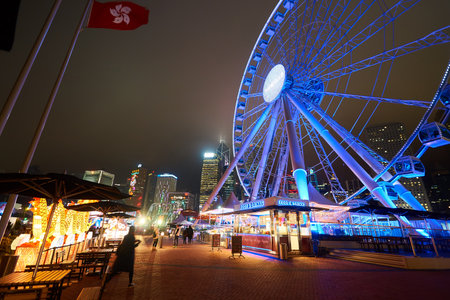 HONG KONG - JANUARY 25, 2016: Ferris Wheel in Hong Kong at night. The Hong Kong Observation Wheel is located in Central, Hong Kong.のeditorial素材