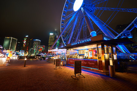 HONG KONG - JANUARY 25, 2016: Ferris Wheel in Hong Kong at night. The Hong Kong Observation Wheel is...