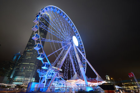 HONG KONG - JANUARY 25, 2016: Ferris Wheel in Hong Kong at night. The Hong Kong Observation Wheel is located in Central, Hong Kong.のeditorial素材