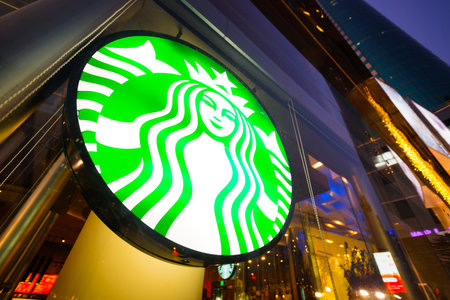 SHENZHEN, CHINA - FEBRUARY 05, 2016: facade of Starbucks Cafe. Starbucks Corporation is an American global coffee company and coffeehouse chain based in Seattle, Washingtonのeditorial素材