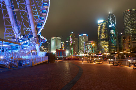 HONG KONG - JANUARY 25, 2016: area around Ferris Wheel in Hong Kong at night. The Hong Kong Observation Wheel is located in Central, Hong Kong.のeditorial素材
