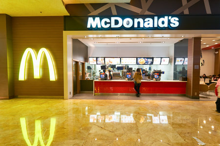 MACAO - FEBRUARY 16, 2016: interior of McDonald's restaurant. McDonald's primarily sells hamburgers,...