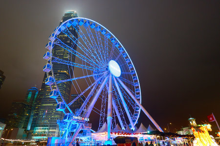 HONG KONG - JANUARY 25, 2016: Ferris Wheel in Hong Kong at night. The Hong Kong Observation Wheel is located in Central, Hong Kong.のeditorial素材
