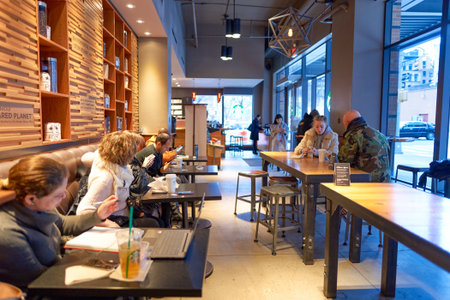 NEW YORK - CIRCA MARCH 2016: inside of Starbucks Cafe. Starbucks Corporation is an American global...