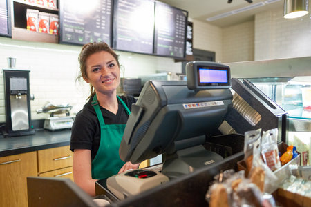 SAINT PETERSBURG, RUSSIA - MARCH 12, 2016: worker at Starbucks Cafe. Starbucks Corporation is an American global coffee company and coffeehouse chain based in Seattle, Washingtonのeditorial素材