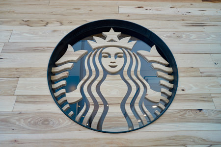 NEW YORK - APRIL 06, 2016: logo of Starbucks Cafe. Starbucks Corporation is an American global coffee company and coffeehouse chain based in Seattle, Washingtonのeditorial素材