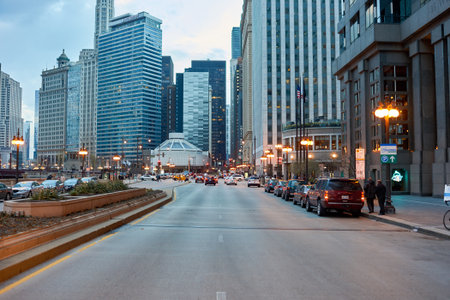 CHICAGO, IL - CIRCA APRIL, 2016: streets of Chicago at evening. Chicago, colloquially known as the Windy City, is the third most populous city in the USA, following New York and Los Angeles