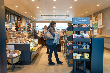 NEW YORK - CIRCA APRIL 2016: inside of Starbucks Cafe. Starbucks Corporation is an American global...