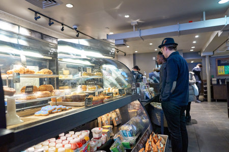 NEW YORK - CIRCA MARCH 2016: inside of Starbucks Cafe. Starbucks Corporation is an American global coffee company and coffeehouse chain based in Seattle, Washingtonのeditorial素材