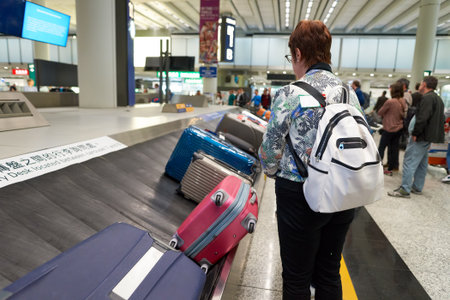 HONG KONG - APRIL 09, 2016: baggage claim area in Hong Kong International Airport. Hong Kong International Airport is the main airport in Hong Kongのeditorial素材