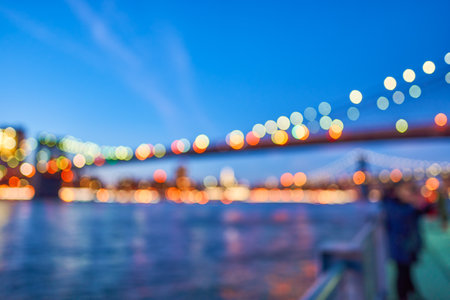 Defocused view of New-York City downtown from Brooklyn at eveningの写真素材