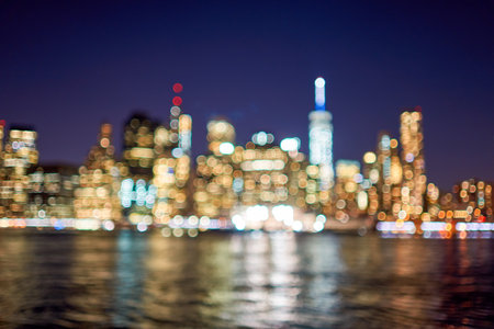 Defocused view of New-York City downtown from Brooklyn at nightの写真素材