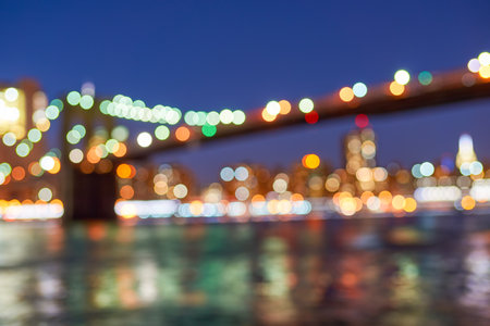 Defocused view of New-York City downtown from Brooklyn at eveningの写真素材