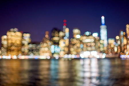 Defocused view of New-York City downtown from Brooklyn at nightの写真素材
